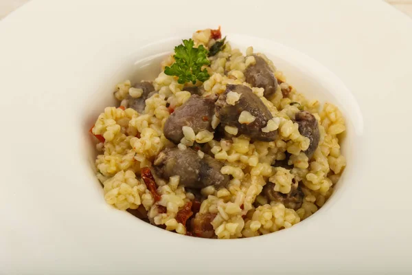 Bulgur with chicken hearts — Stock Photo, Image