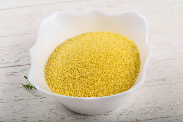 Raw couscous  in the bowl — Stock Photo, Image