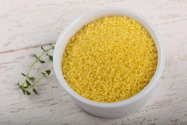 Raw couscous  in the bowl — Stock Photo, Image