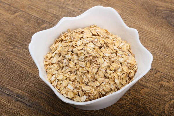 Raw oatmeal  in the bowl — Stock Photo, Image