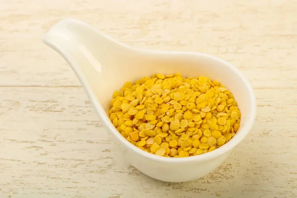 Yellow lentil in the bowl — Stock Photo, Image