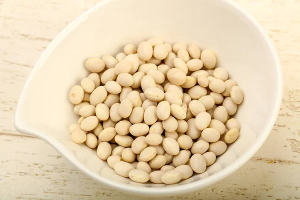 Dry white beans in the bowl — Stock Photo, Image