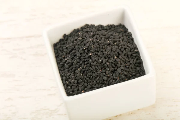 Black nigella in the bowl — Stock Photo, Image