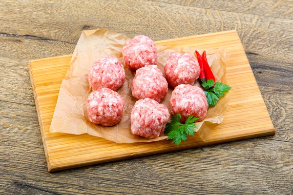Raw meatball with pepper — Stock Photo, Image