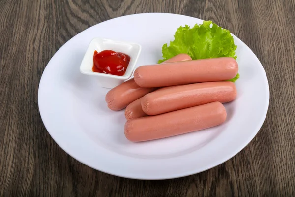 Boiled Sausages with salad — Stock Photo, Image