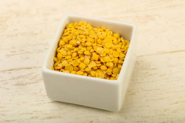 Yellow lentil in the bowl