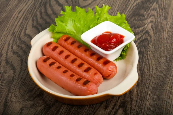 Grilled sausages and ketchup — Stock Photo, Image