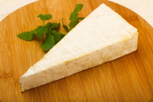 Brie cheese over board — Stock Photo, Image