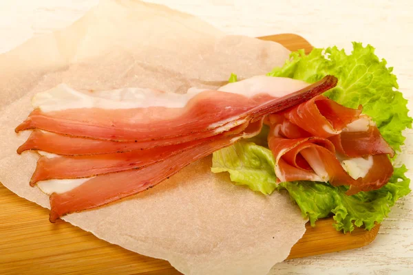 Spanish hamon on baking paper — Stock Photo, Image