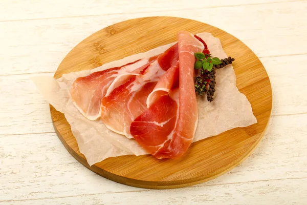 Spanish hamon on baking paper — Stock Photo, Image
