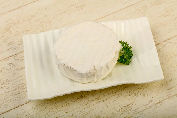 Camembert cheese on plate — Stock Photo, Image