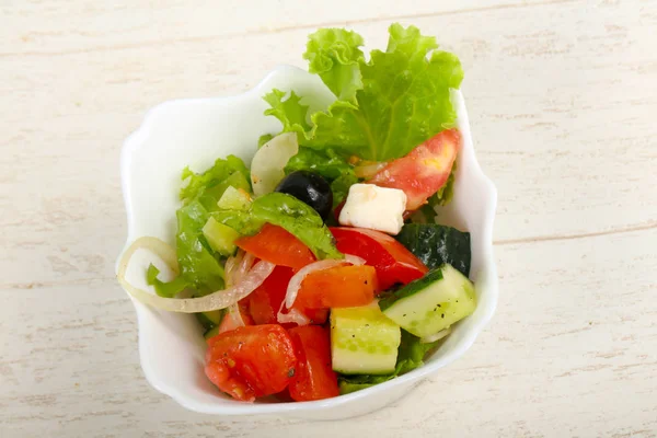 Greek salad in white plate — Stok fotoğraf