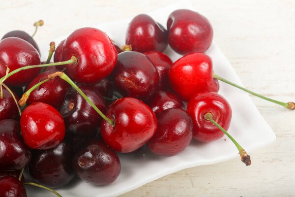 Sweet cherry in white bowl