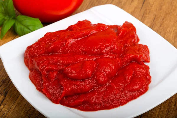 Tomato paste in the bowl — Stock Photo, Image