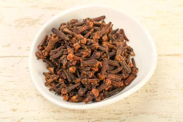 Clove seeds in bowl — Stock Photo, Image