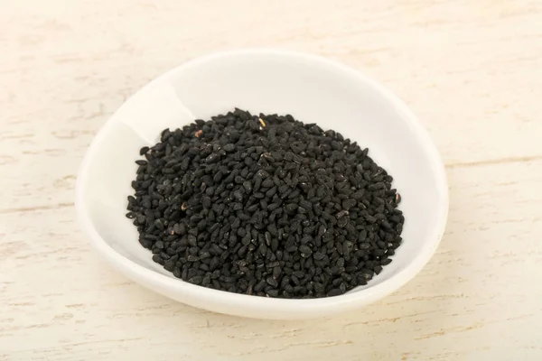 Svart nigella frön heap — Stockfoto