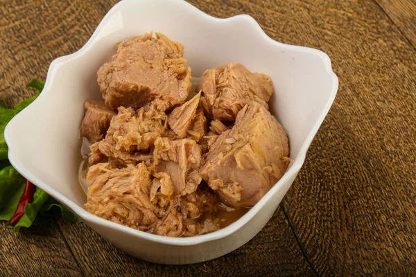 Closeup of canned tuna fish in bowl ready for cooking