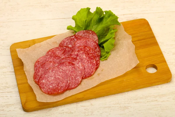 Sliced Salami Sausage Wooden Background — Stock Photo, Image