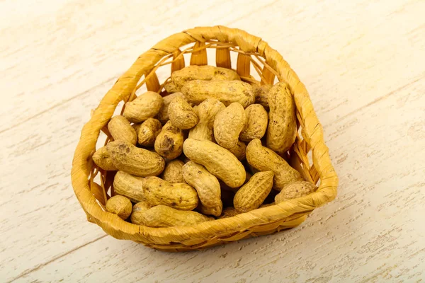 Unpeeled Peanuts Heap Basket Wooden Background — Stock Photo, Image