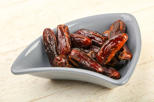 Sweet dates fruit heap in the bowl