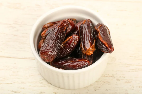 Sweet dates fruit heap in the bowl