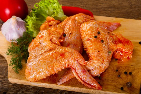 Raw marinated chicken wings for grill and bbq