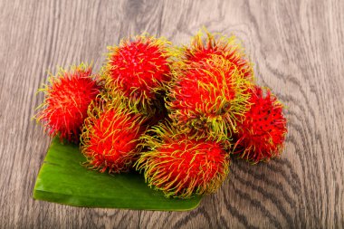 Fresh ripe sweet Rambutan heap - asian fruit clipart
