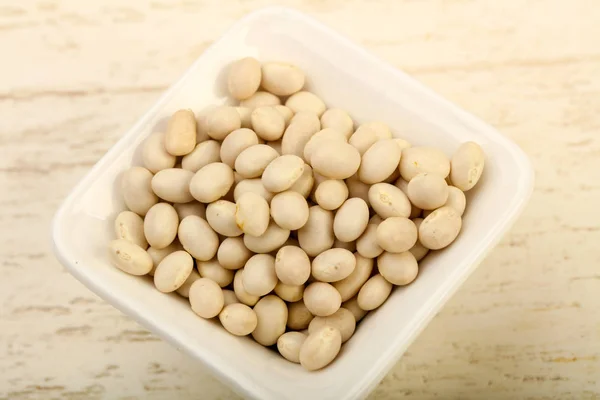 Frijoles Blancos Secos Tazón Sobre Fondo Madera — Foto de Stock