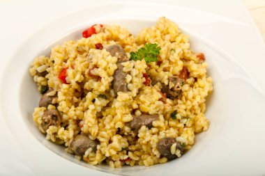 Tavuk kalbi ve kuru domatesli bulgur.