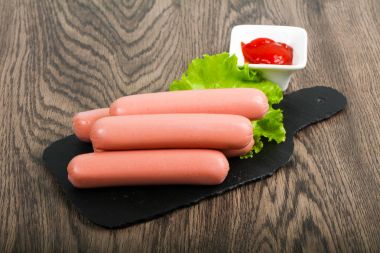 Boiled Sausages with salad and ketchup clipart