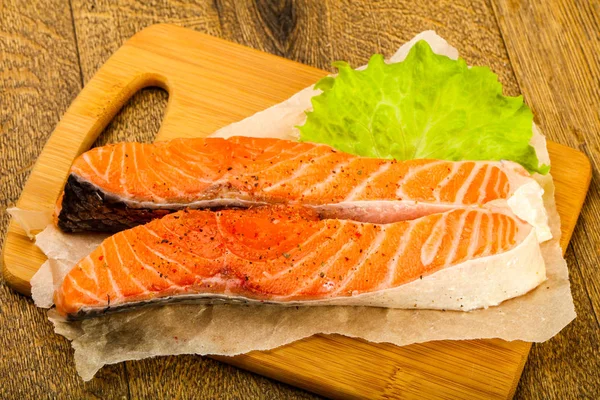 Raw salmon slice ready for baking with spices