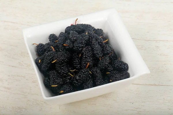 Black Mulberries heap over wooden background — Stock Image Black Mulberries Heap Wooden Background Stock Image