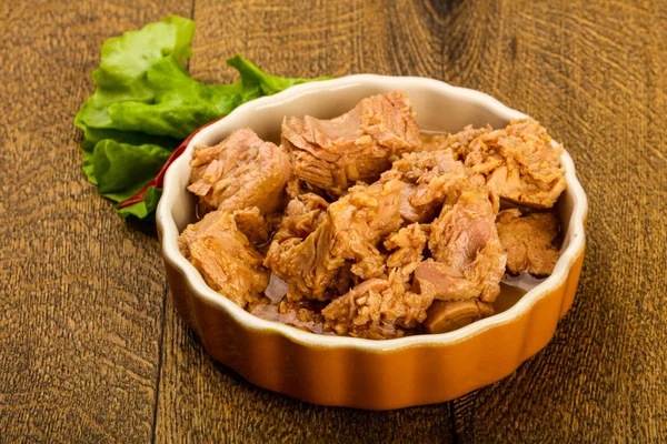 Canned tuna fish in the bowl ready for cooking