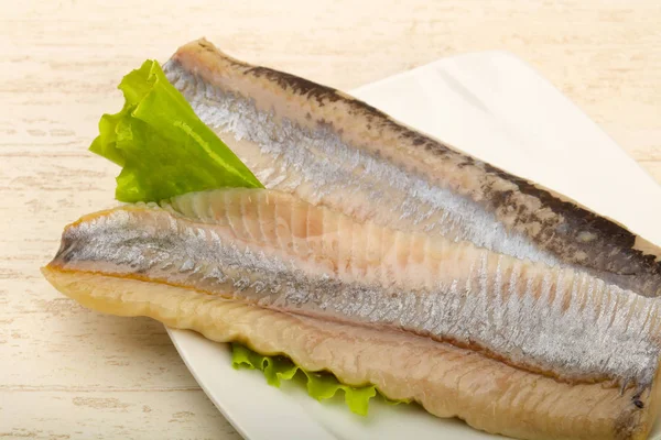 Herring fillet over salad leaves - ready for eat — Stock Image Herring Fillet Salad Leaves Ready Eat Stock Picture