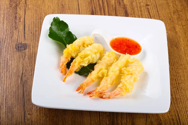 Tiger prawn tempura with green sauce on wood backgrond