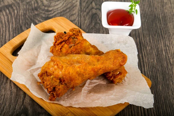 Crispy chicken legs with  ketchup