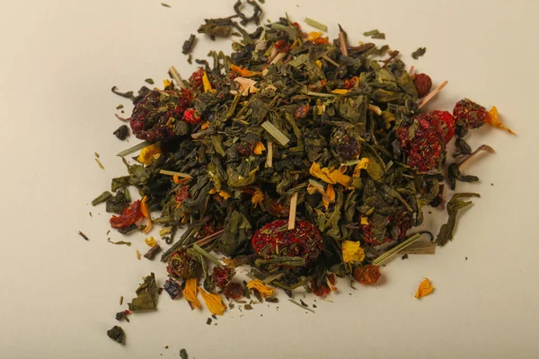 Aroma tea heap with fruit, berries and herbs