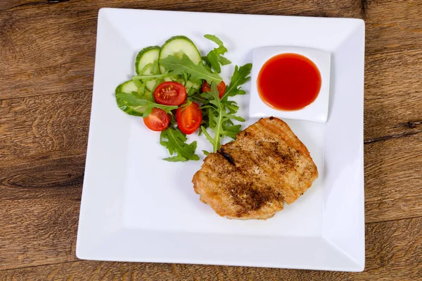 Grilled pork with sauce and salad dressing