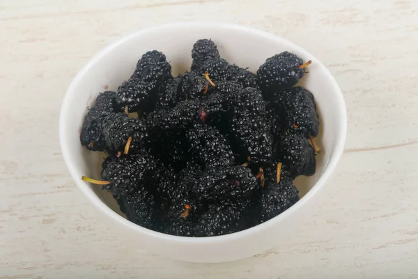 Black Mulberries heap over wooden background — Stock Image Black Mulberries Heap Wooden Background Stock Picture