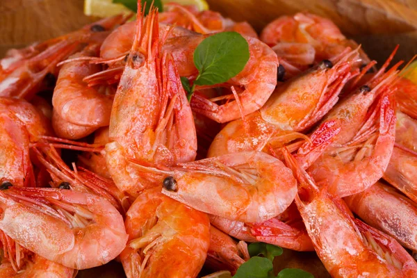 Boiled shrimps with lemon and herbs