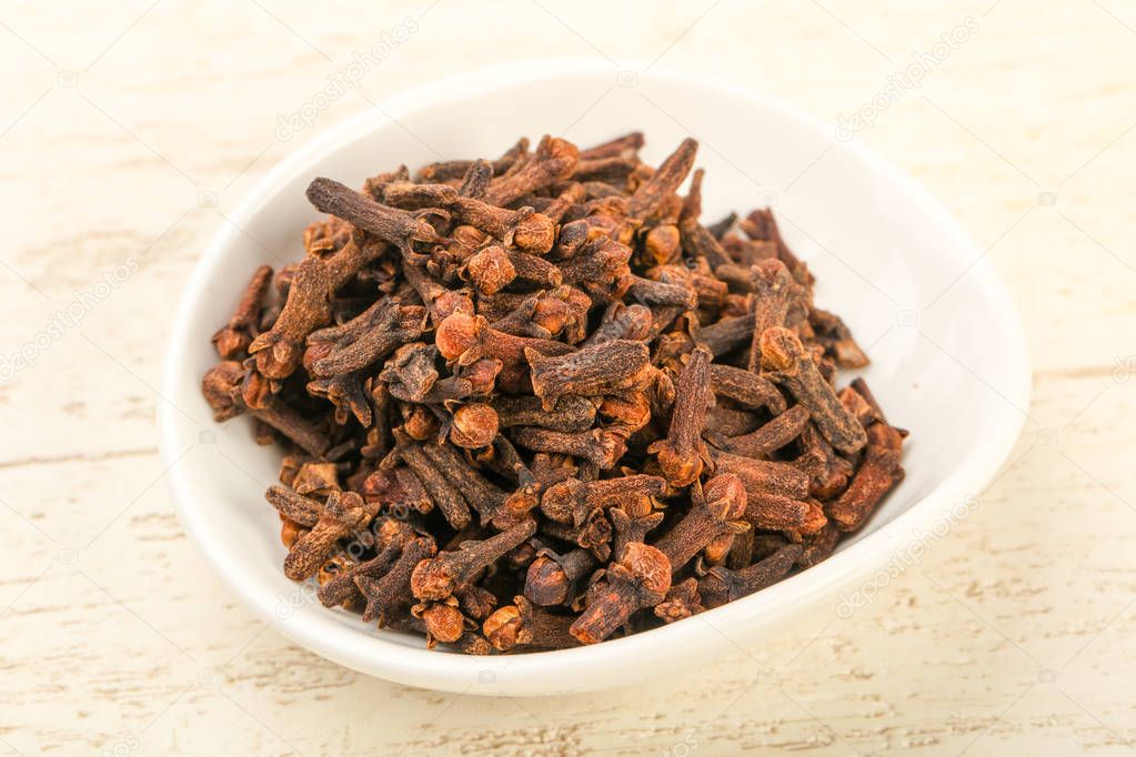Clove seeds in the bowl - spice for cuisine