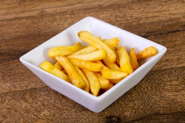 Patates kızartması patates ahşap arka plan üzerinde