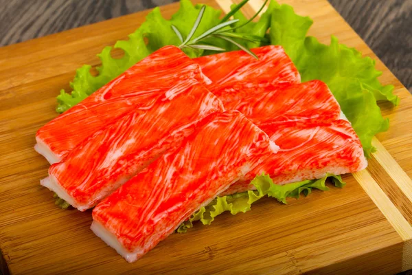 Crab Sticks Över Trä Bakgrunden — Stockfoto