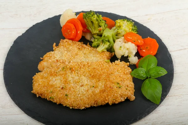 Chicken with sesame seeds and boiled vegetables