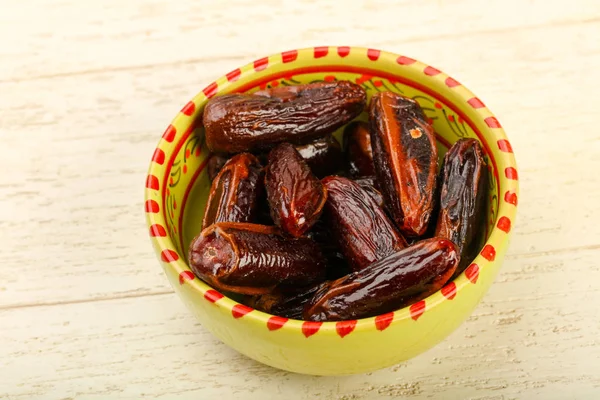 Sweet dates fruit heap in the bowl