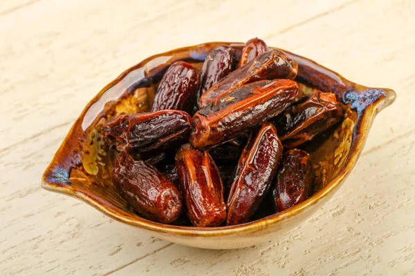 Sweet dates fruit heap in the bowl