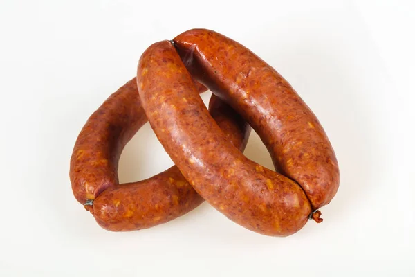 Tasty meat sausages over white background — Stock Photo, Image