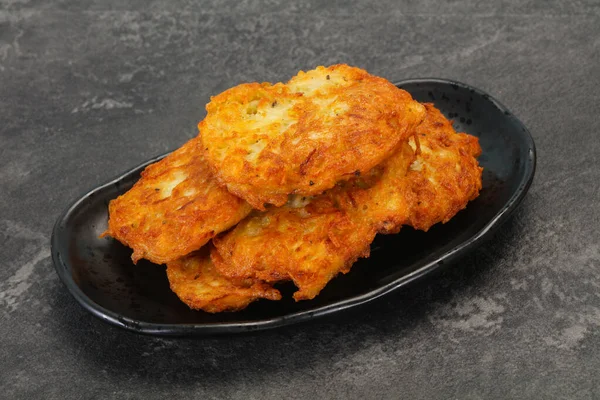 Roasted potato pancakes in the bowl — Stock Photo, Image