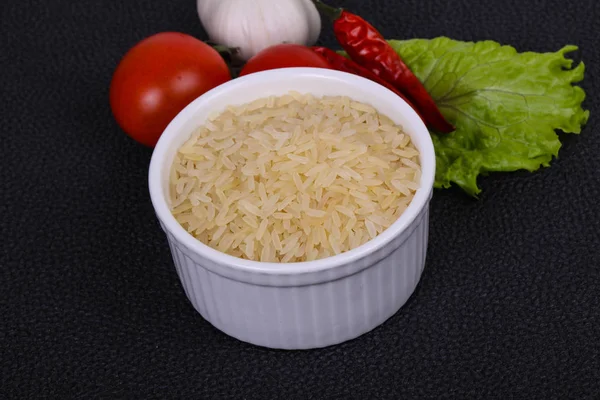 Raw uncooked rice in the bowl — Stock Photo, Image