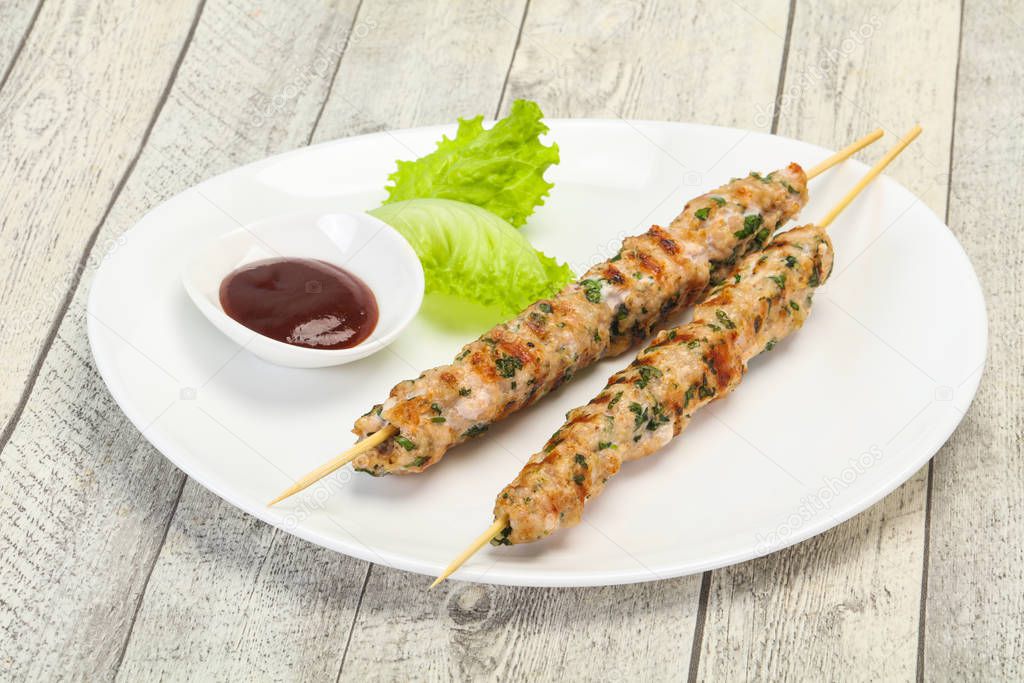 Minced pork skewer kebab with sauce